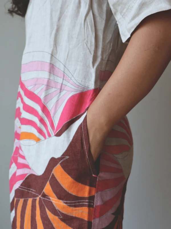 Beige Linen Botanical Print Dress with Pockets | Pocket Dress Woman wearing beige linen dress with bold pink, orange, and maroon botanical print and invisible side pockets, Pocket Dress India