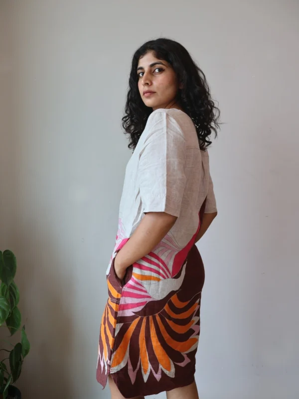 Beige Linen Botanical Print Dress with Pockets | Pocket Dress Woman wearing beige linen dress with bold pink, orange, and maroon botanical print and invisible side pockets, Pocket Dress India