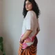 Beige Linen Botanical Print Dress with Pockets | Pocket Dress Woman wearing beige linen dress with bold pink, orange, and maroon botanical print and invisible side pockets, Pocket Dress India