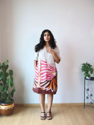 Beige Linen Botanical Print Dress with Pockets | Pocket Dress Woman wearing beige linen dress with bold pink, orange, and maroon botanical print and invisible side pockets, Pocket Dress India
