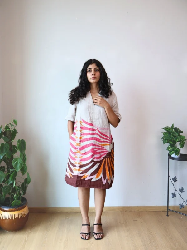 Beige Linen Botanical Print Dress with Pockets | Pocket Dress Woman wearing beige linen dress with bold pink, orange, and maroon botanical print and invisible side pockets, Pocket Dress India