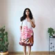 Beige Linen Botanical Print Dress with Pockets | Pocket Dress Woman wearing beige linen dress with bold pink, orange, and maroon botanical print and invisible side pockets, Pocket Dress India