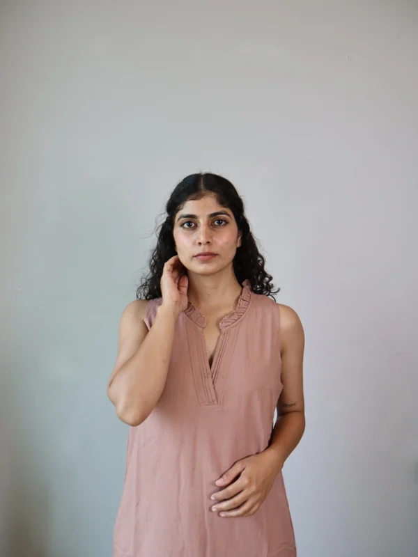 Mocha Ruffled Shift Dress with Pockets | Pocket Dress Woman wearing dusty mocha sleeveless shift dress with ruffled V-neckline and invisible side pockets, Pocket Dress India
