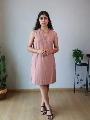Mocha Ruffled Shift Dress with Pockets | Pocket Dress Woman wearing dusty mocha sleeveless shift dress with ruffled V-neckline and invisible side pockets, Pocket Dress India