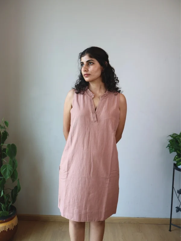 Mocha Ruffled Shift Dress with Pockets | Pocket Dress Woman wearing dusty mocha sleeveless shift dress with ruffled V-neckline and invisible side pockets, Pocket Dress India