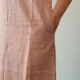 Mocha Ruffled Shift Dress with Pockets | Pocket Dress Woman wearing dusty mocha sleeveless shift dress with ruffled V-neckline and invisible side pockets, Pocket Dress India