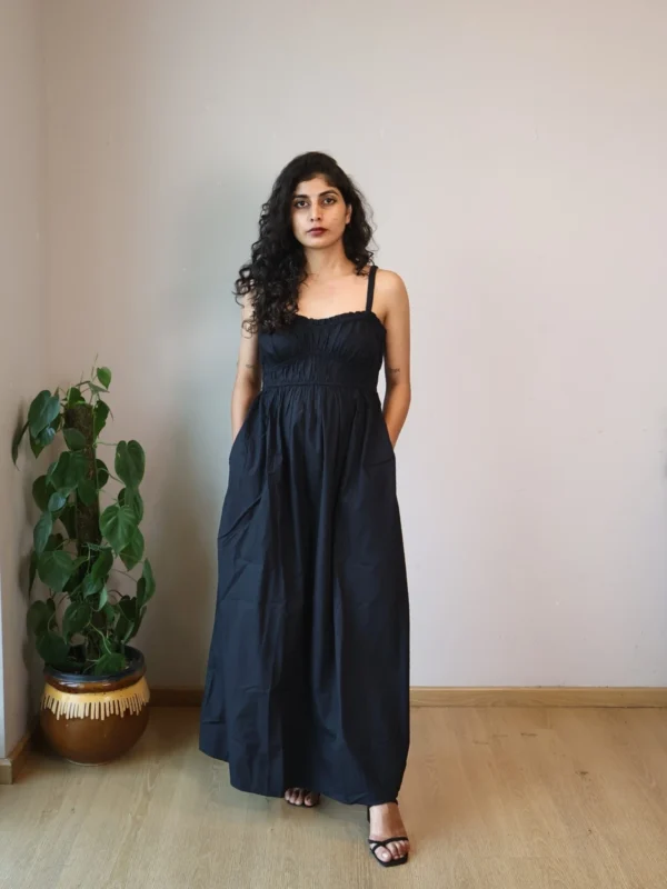 Black Smocked Strappy Maxi Dress with Pockets | Pocket Dress Woman wearing black smocked strappy maxi dress with invisible side pockets, Pocket Dress India