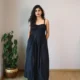 Black Smocked Strappy Maxi Dress with Pockets | Pocket Dress Woman wearing black smocked strappy maxi dress with invisible side pockets, Pocket Dress India