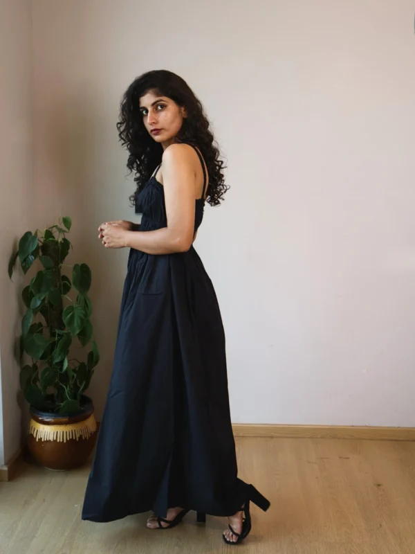 Black Smocked Strappy Maxi Dress with Pockets | Pocket Dress Woman wearing black smocked strappy maxi dress with invisible side pockets, Pocket Dress India