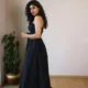 Black Smocked Strappy Maxi Dress with Pockets | Pocket Dress Woman wearing black smocked strappy maxi dress with invisible side pockets, Pocket Dress India