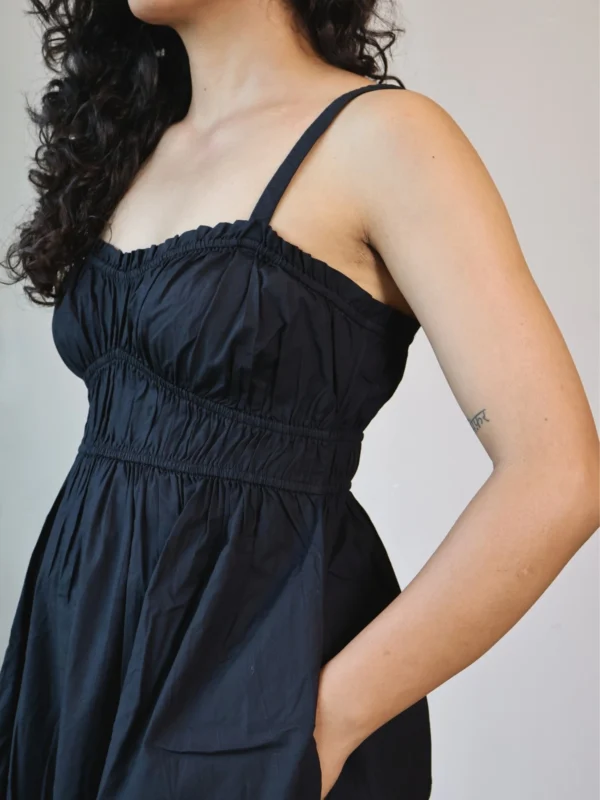 Black Smocked Strappy Maxi Dress with Pockets | Pocket Dress Woman wearing black smocked strappy maxi dress with invisible side pockets, Pocket Dress India