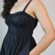 Black Smocked Strappy Maxi Dress with Pockets | Pocket Dress Woman wearing black smocked strappy maxi dress with invisible side pockets, Pocket Dress India