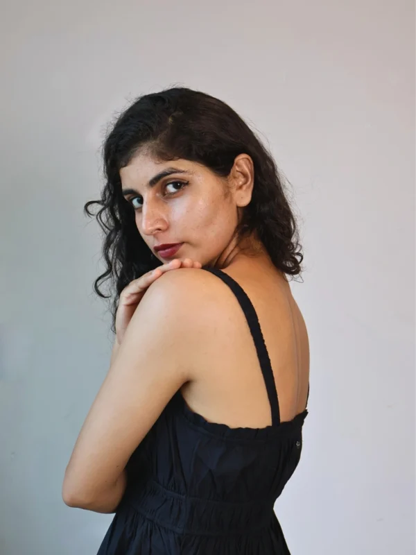 Black Smocked Strappy Maxi Dress with Pockets | Pocket Dress Woman wearing black smocked strappy maxi dress with invisible side pockets, Pocket Dress India