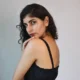 Black Smocked Strappy Maxi Dress with Pockets | Pocket Dress Woman wearing black smocked strappy maxi dress with invisible side pockets, Pocket Dress India