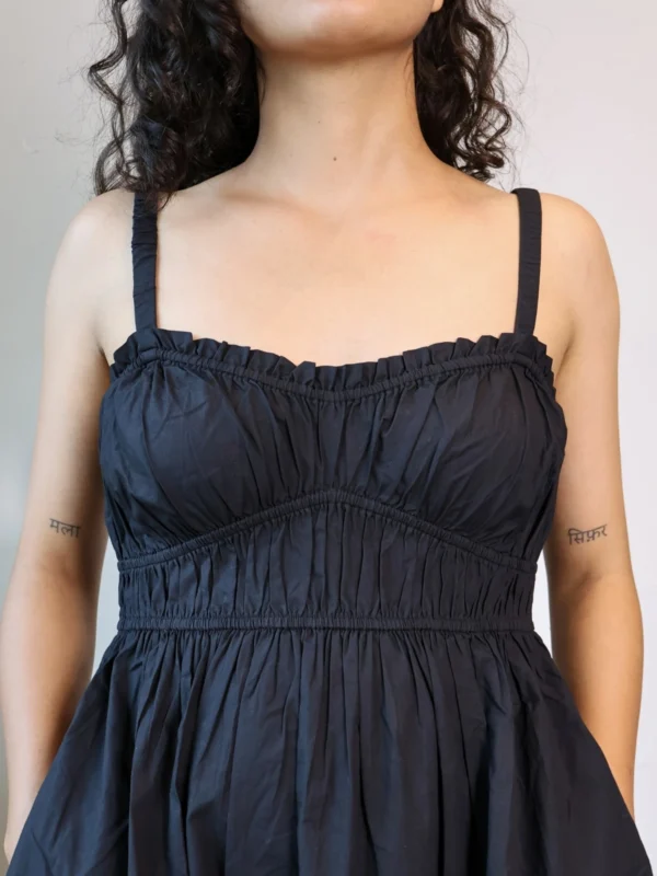 Black Smocked Strappy Maxi Dress with Pockets | Pocket Dress Woman wearing black smocked strappy maxi dress with invisible side pockets, Pocket Dress India