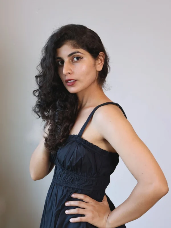 Black Smocked Strappy Maxi Dress with Pockets | Pocket Dress Woman wearing black smocked strappy maxi dress with invisible side pockets, Pocket Dress India