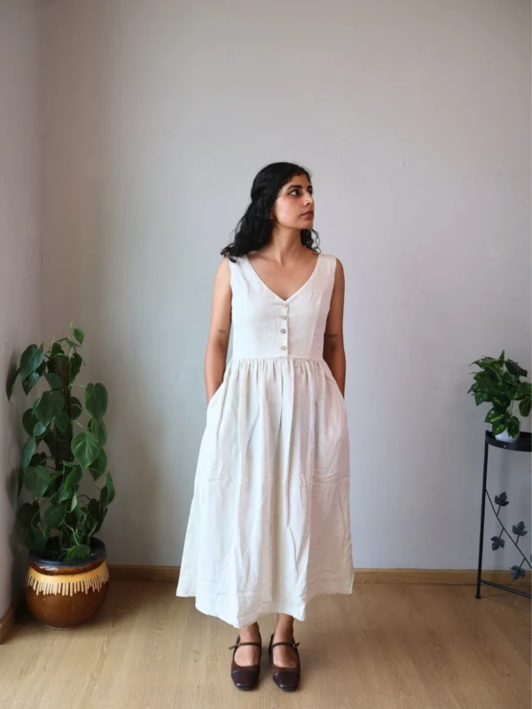 Ivory V-Neck Midi Dress with Pockets | Pocket Dress Woman wearing ivory V-neck midi dress with button accents and invisible side pockets, Pocket Dress India