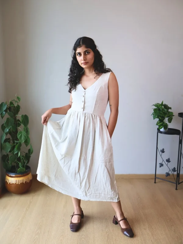 Ivory V-Neck Midi Dress with Pockets | Pocket Dress Woman wearing ivory V-neck midi dress with button accents and invisible side pockets, Pocket Dress India