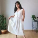 Ivory V-Neck Midi Dress with Pockets | Pocket Dress Woman wearing ivory V-neck midi dress with button accents and invisible side pockets, Pocket Dress India