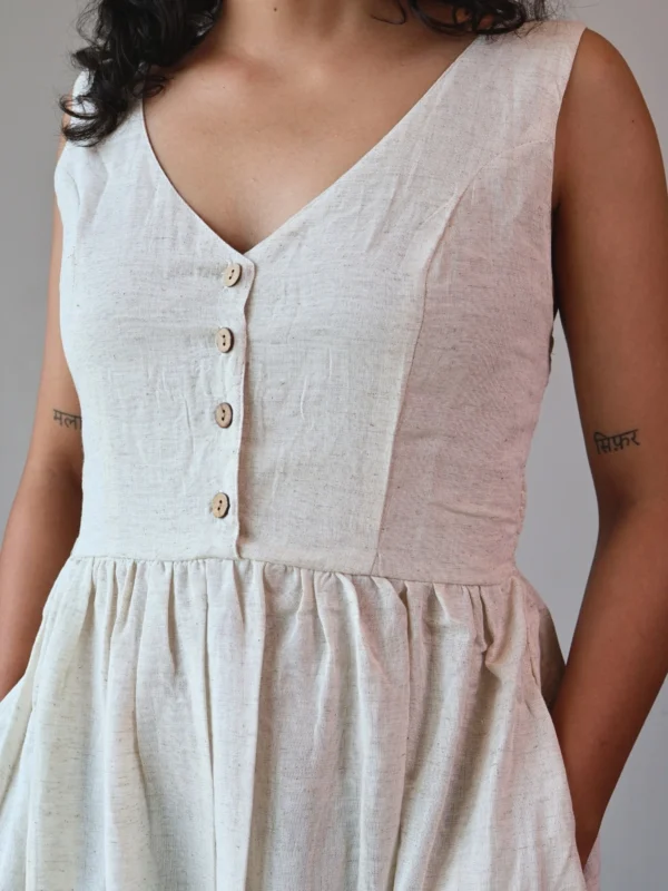 Ivory V-Neck Midi Dress with Pockets | Pocket Dress Woman wearing ivory V-neck midi dress with button accents and invisible side pockets, Pocket Dress India