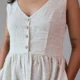 Ivory V-Neck Midi Dress with Pockets | Pocket Dress Woman wearing ivory V-neck midi dress with button accents and invisible side pockets, Pocket Dress India