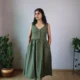 Olive V-Neck Midi Dress with Pockets | Pocket Dress Woman wearing olive green sleeveless V-neck midi dress with invisible side pockets, Pocket Dress India