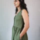 Olive V-Neck Midi Dress with Pockets | Pocket Dress Woman wearing olive green sleeveless V-neck midi dress with invisible side pockets, Pocket Dress India