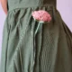 Olive V-Neck Midi Dress with Pockets | Pocket Dress Woman wearing olive green sleeveless V-neck midi dress with invisible side pockets, Pocket Dress India