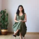 Olive V-Neck Midi Dress with Pockets | Pocket Dress Woman wearing olive green sleeveless V-neck midi dress with invisible side pockets, Pocket Dress India