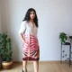 Beige Linen Botanical Print Dress with Pockets | Pocket Dress Woman wearing beige linen dress with bold pink, orange, and maroon botanical print and invisible side pockets, Pocket Dress India