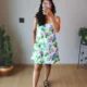 Pastel Floral Mini Dress with Pockets | Pocket Dress Woman wearing white A-line mini dress with lavender, sky blue, and green floral print and invisible side pockets, Pocket Dress India