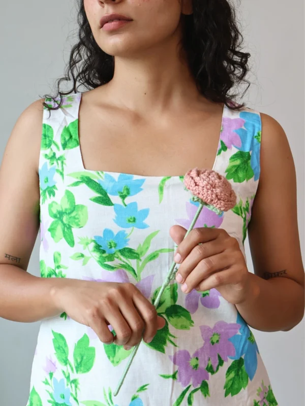 Pastel Floral Mini Dress with Pockets | Pocket Dress Woman wearing white A-line mini dress with lavender, sky blue, and green floral print and invisible side pockets, Pocket Dress India
