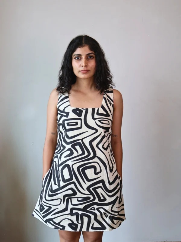 Monochrome Abstract Print Mini Dress with Pockets | Pocket Dress Woman wearing black and off-white geometric abstract print A-line mini dress with invisible side pockets, Pocket Dress India