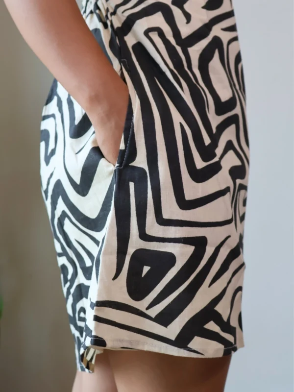 Monochrome Abstract Print Mini Dress with Pockets | Pocket Dress Woman wearing black and off-white geometric abstract print A-line mini dress with invisible side pockets, Pocket Dress India
