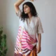 Beige Linen Botanical Print Dress with Pockets | Pocket Dress Woman wearing beige linen dress with bold pink, orange, and maroon botanical print and invisible side pockets, Pocket Dress India