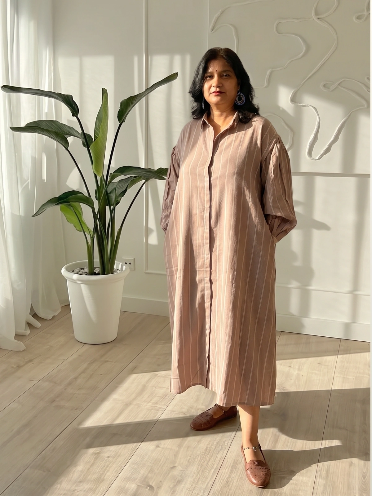Woman wearing dusty mauve pinstripe oversized shirt dress with gathered sleeves and invisible side pockets, Pocket Dress India