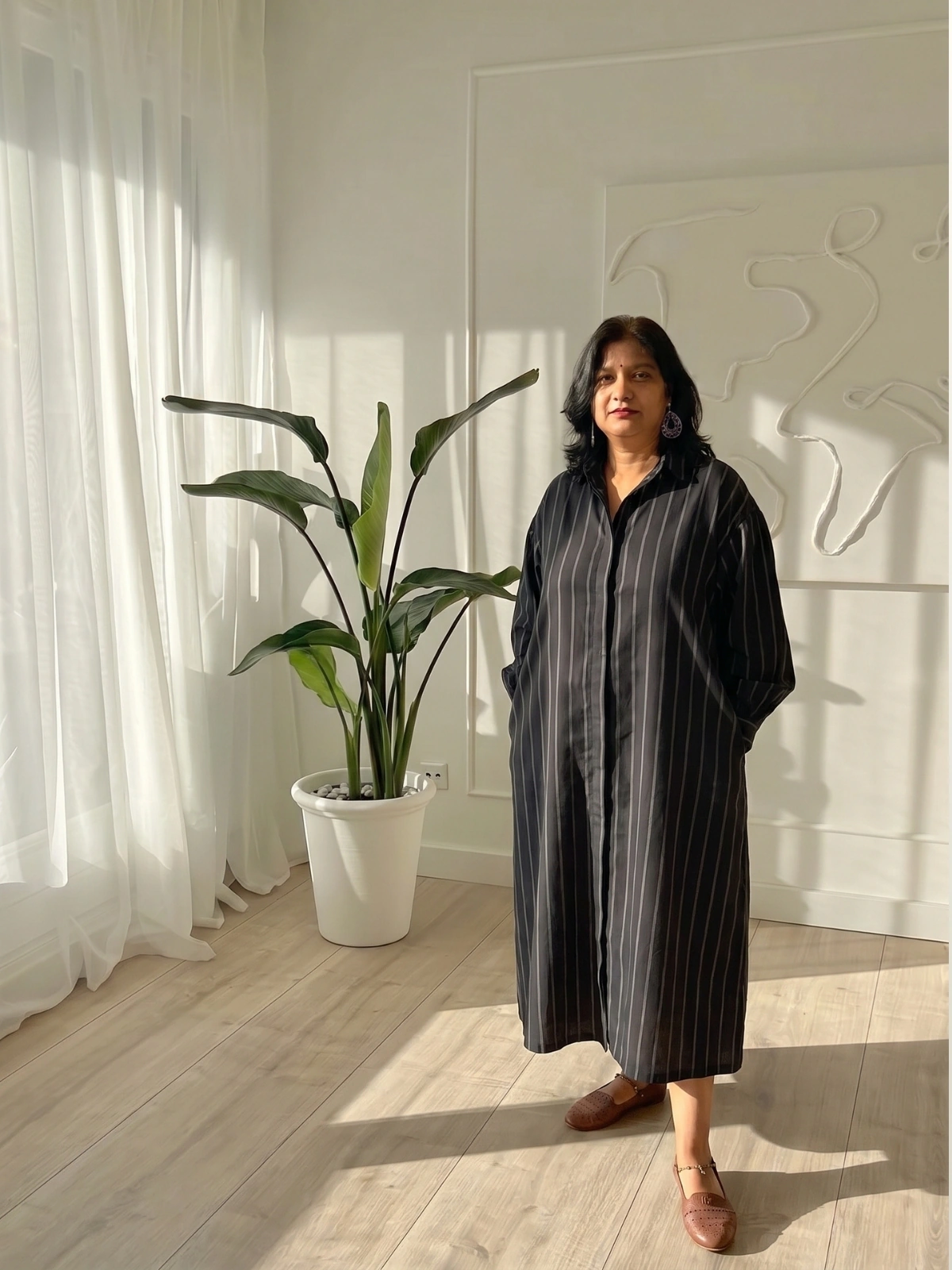 Woman wearing charcoal pinstripe button-down shirt dress with invisible side pockets, Pocket Dress India