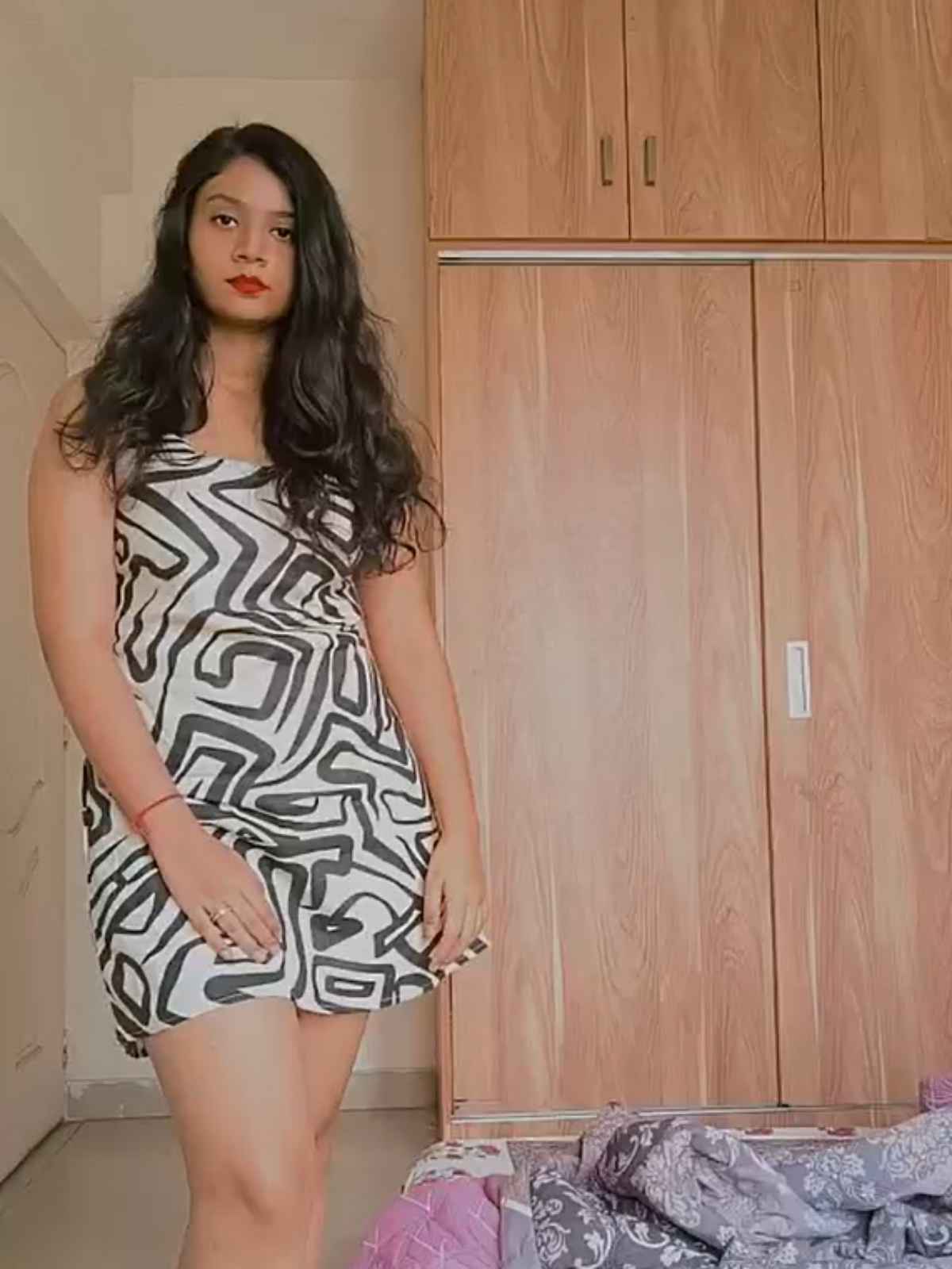 Woman wearing Pocket Dress abstract print mini dress with deep, invisible side-seam pockets
