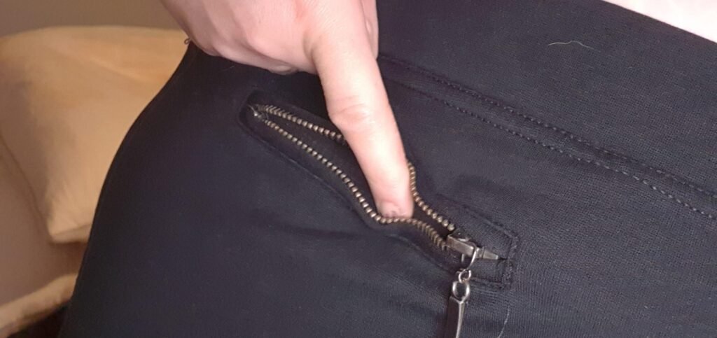A real example of a shallow pocket on women's pants, too small to hold a phone or keys